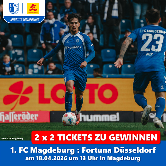 Foto von zwei Spielern des 1. FC Magdeburg vor Bande mit LOTTO-Schriftzug
